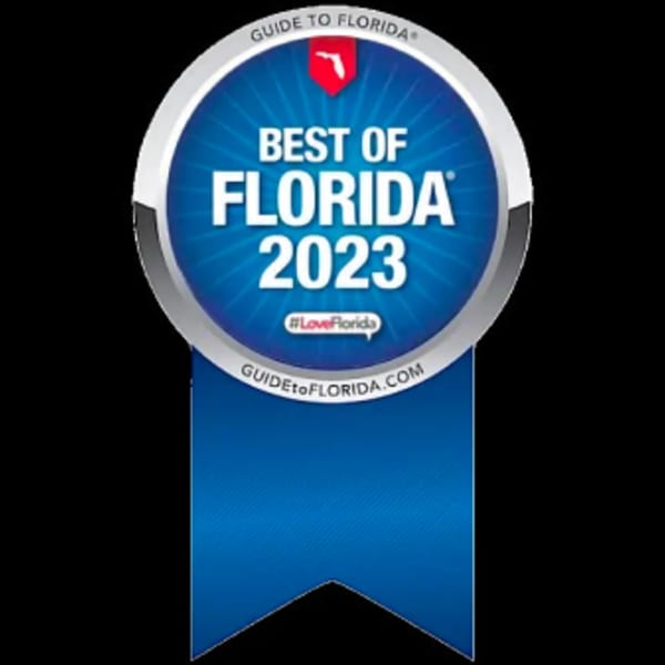 Blue and silver 'Best of Florida 2023' award ribbon from Guide to Florida.