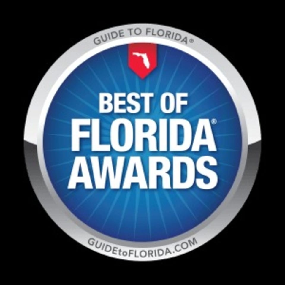 Blue and silver circular badge with "Best of Florida Awards" and "Guide to Florida" text.